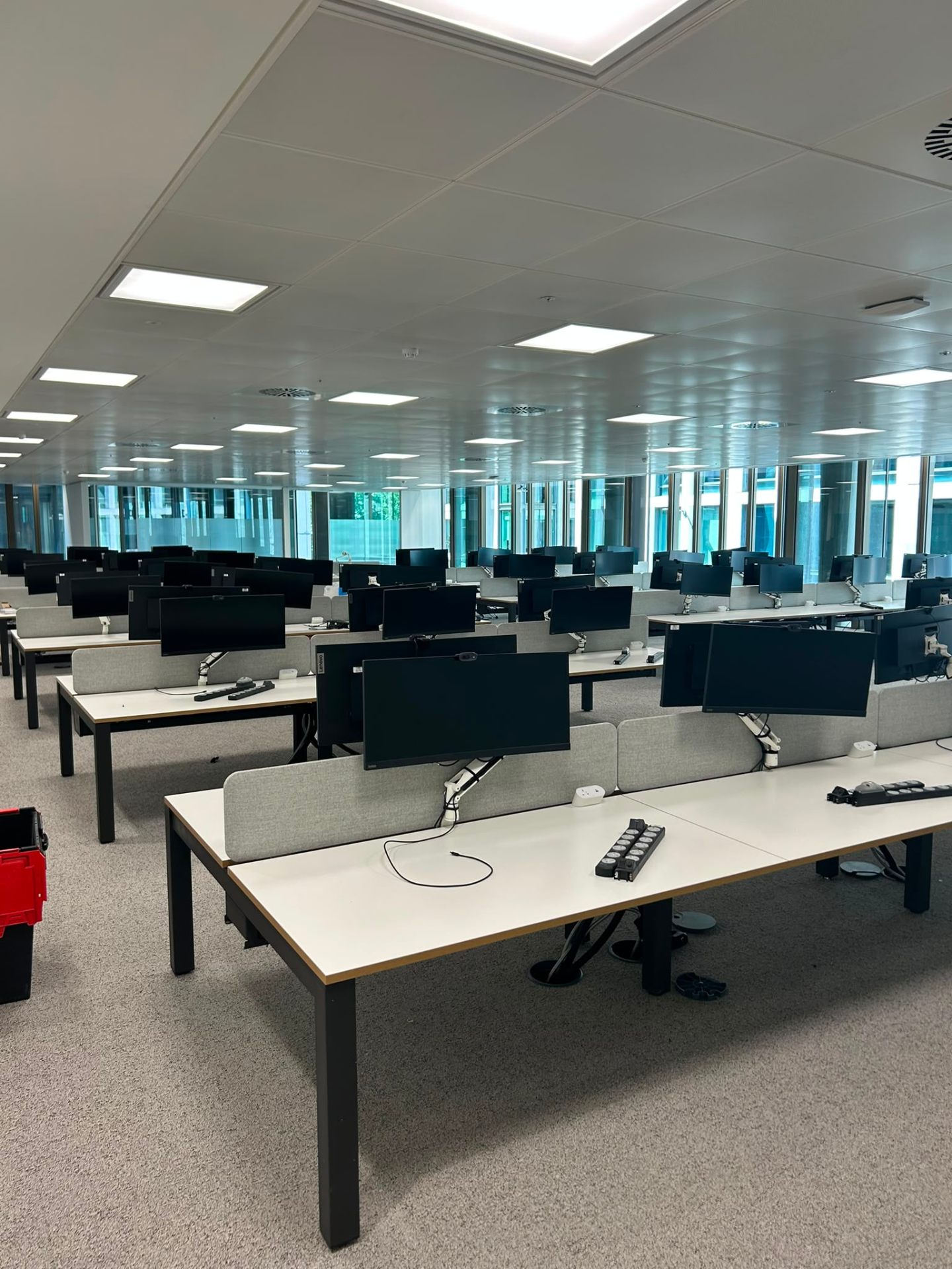 Completed open-plan workstation installation with dual monitors, London